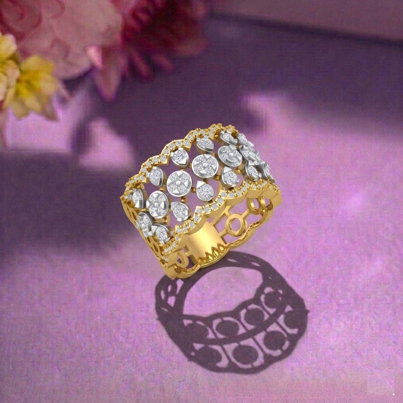 Gold ring and diamond cocktail ring on a purple surface