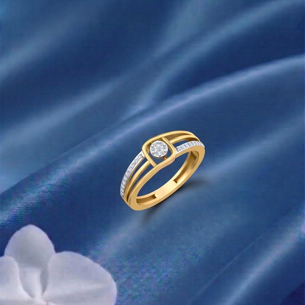 Gold and diamond with center cluster setting on a blue surface.