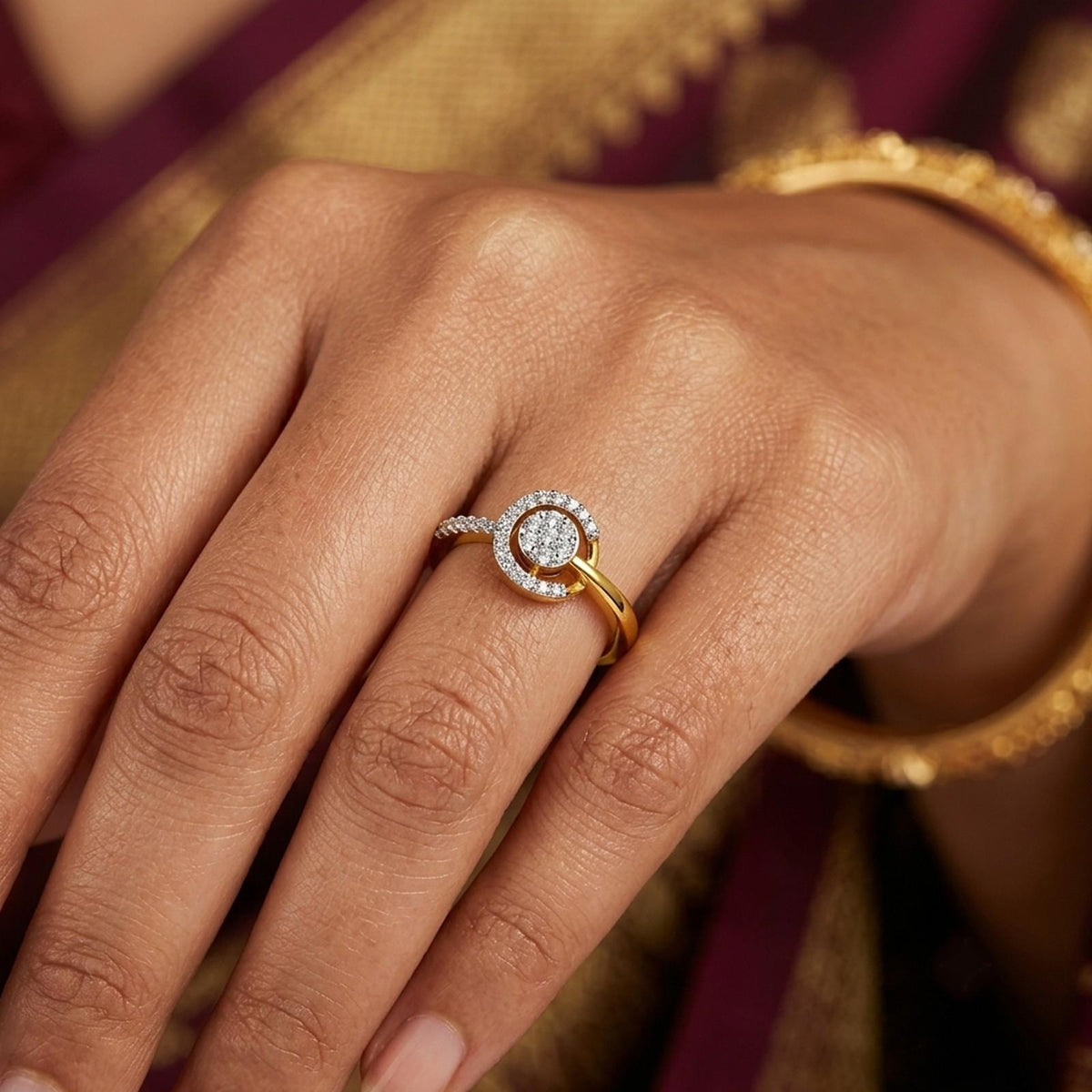 Close-up shot of a gold and diamond with halo cluster ring.