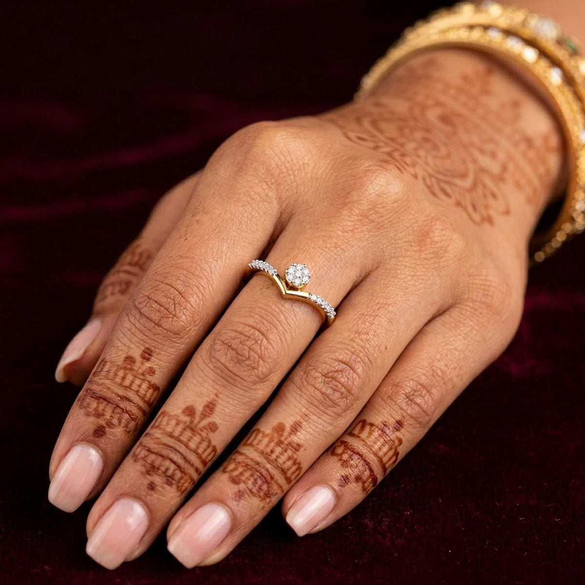 Close-up shot of a gold and diamond with cluster setting women's ring.
