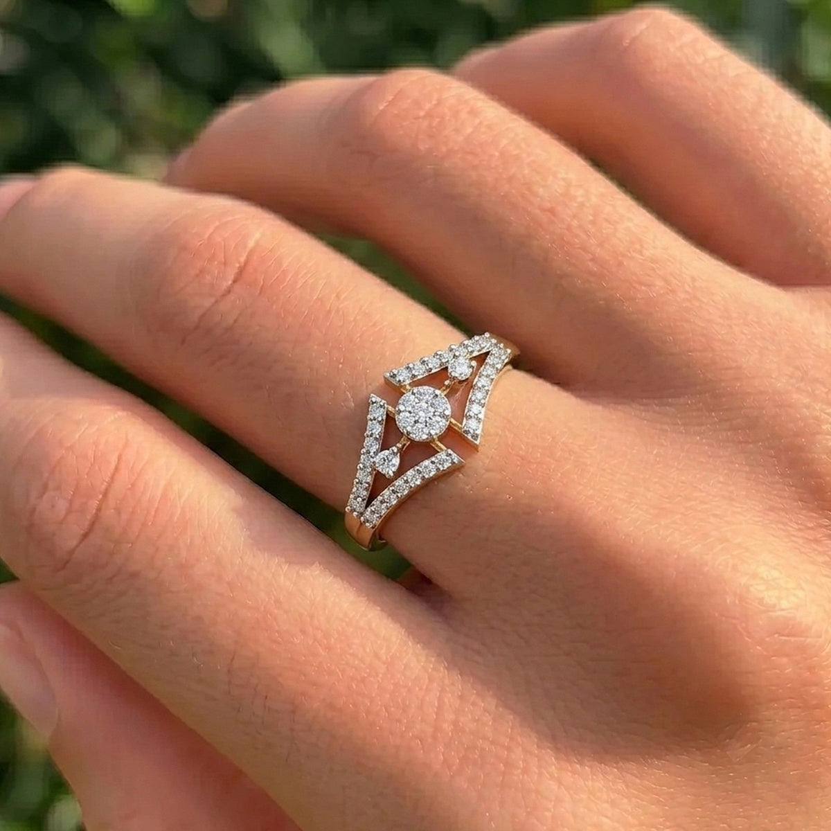 Close-up shot of a gold and diamond with cluster ring.