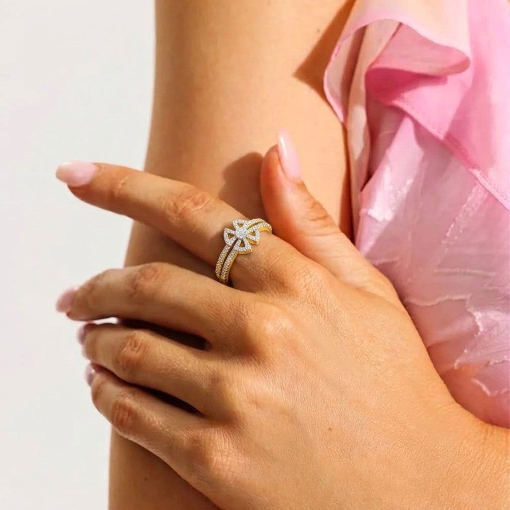 Close-up shot of a gold and diamond with floral design ring.