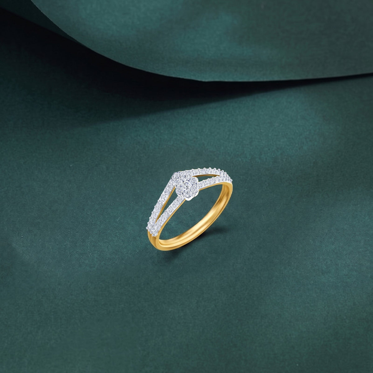 Gold and diamond with cluster on a teal surface.