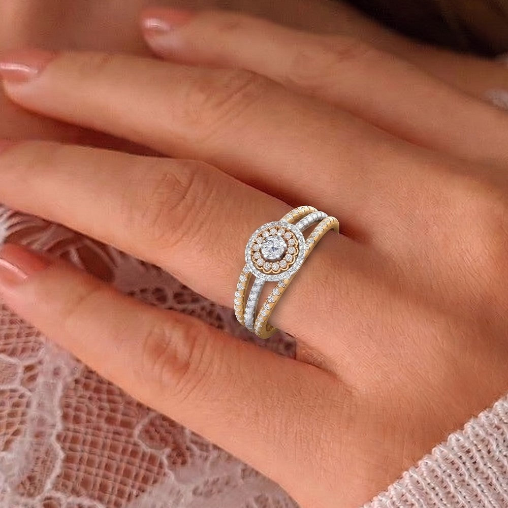Close-up of a hand wearing a gold and diamond ring on a lace fabric background