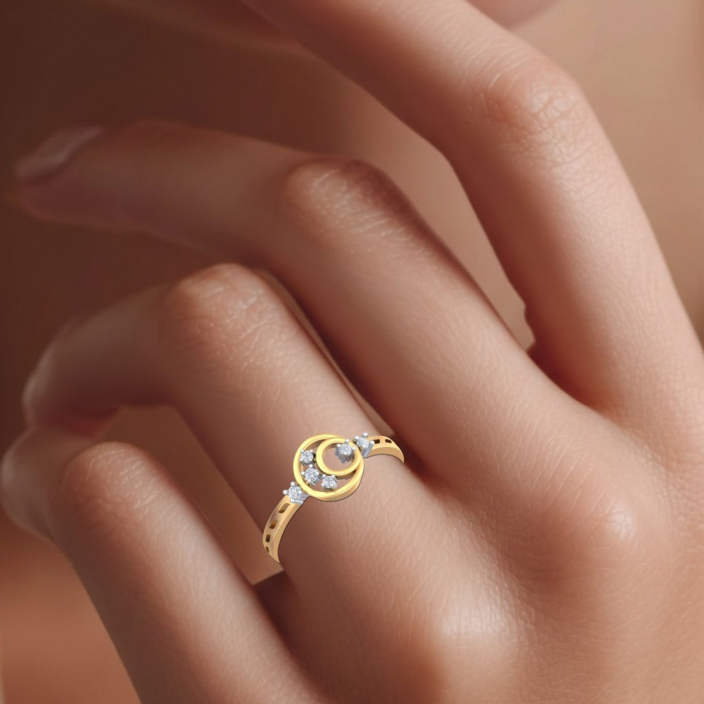 Gold and diamond with halo design on a person's finger.