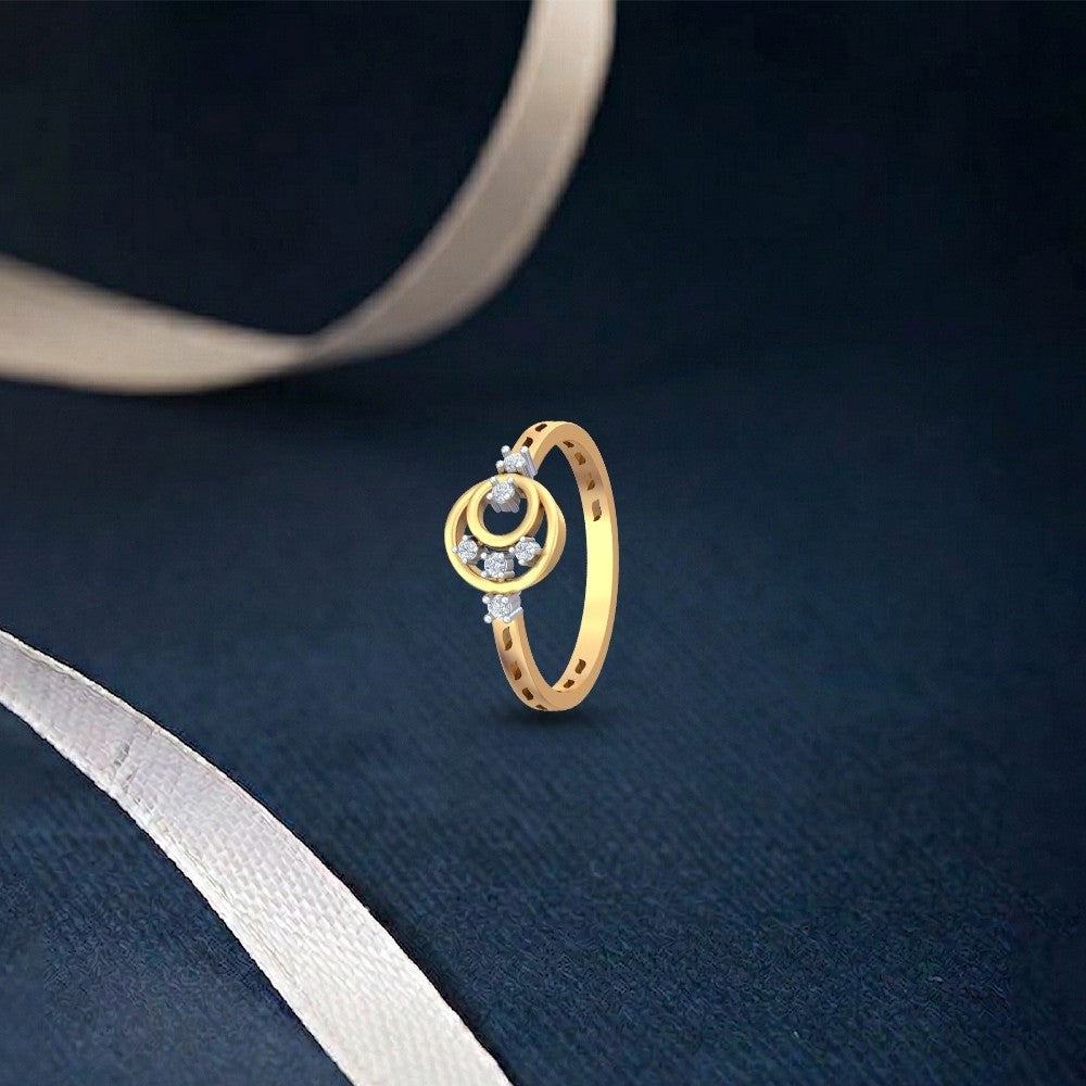 Gold and diamond with halo design on a blue surface.