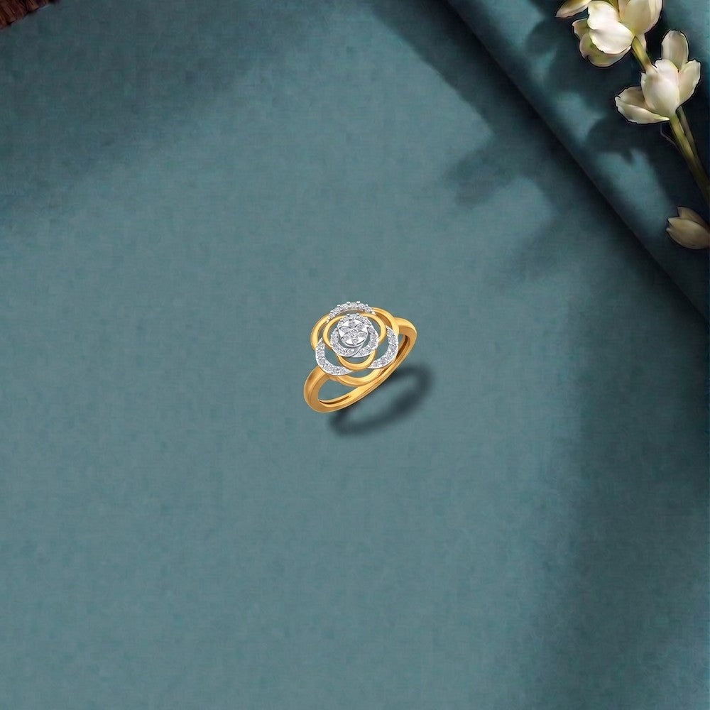 Gold and diamond with floral design on a teal surface.