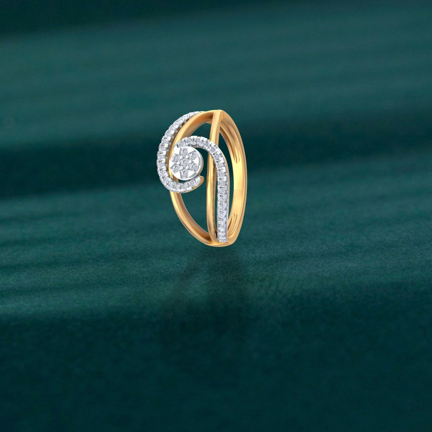 Gold ring with diamond accents on a green textured background.