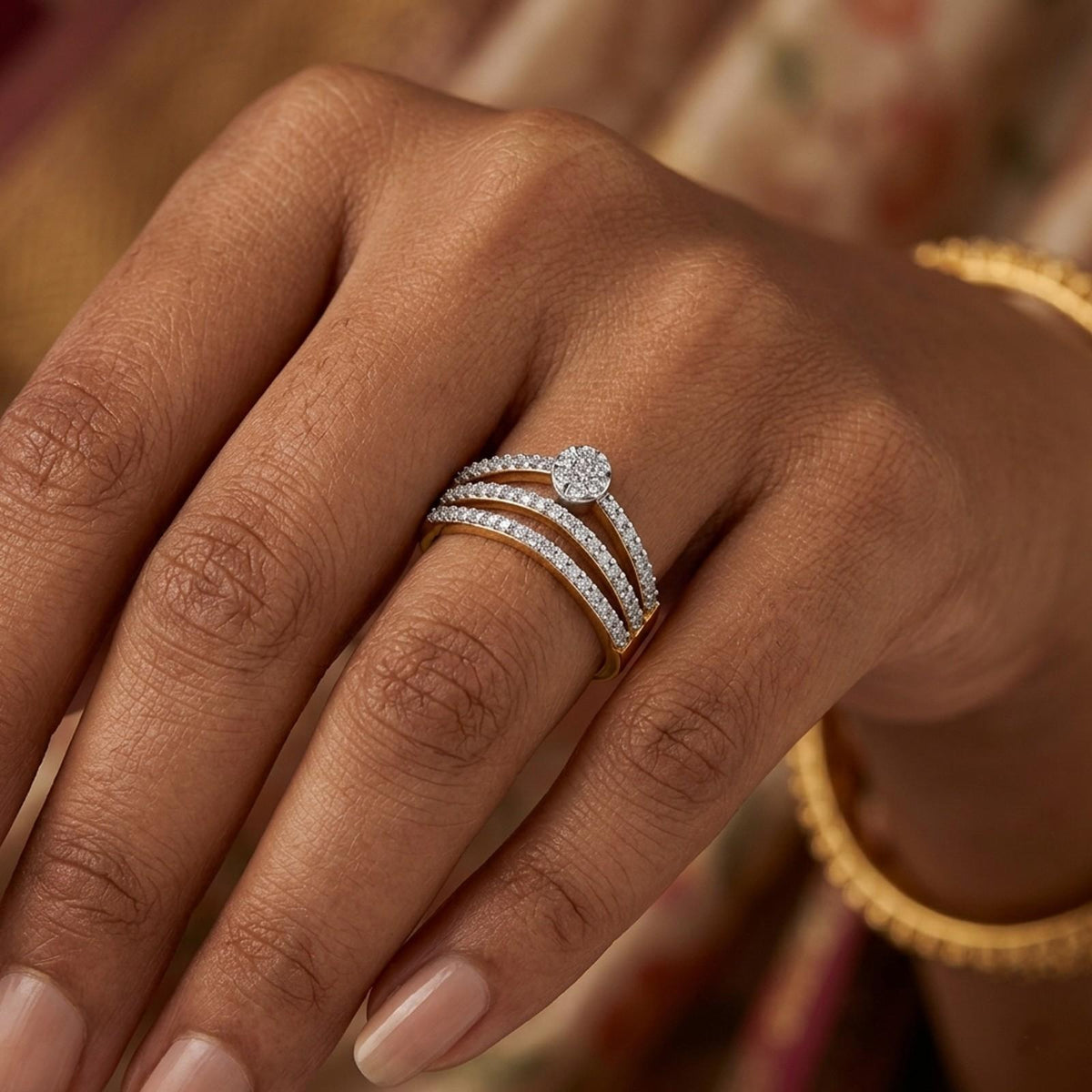 Close-up of a hand wearing a gold ring with a diamond on a neutral background.