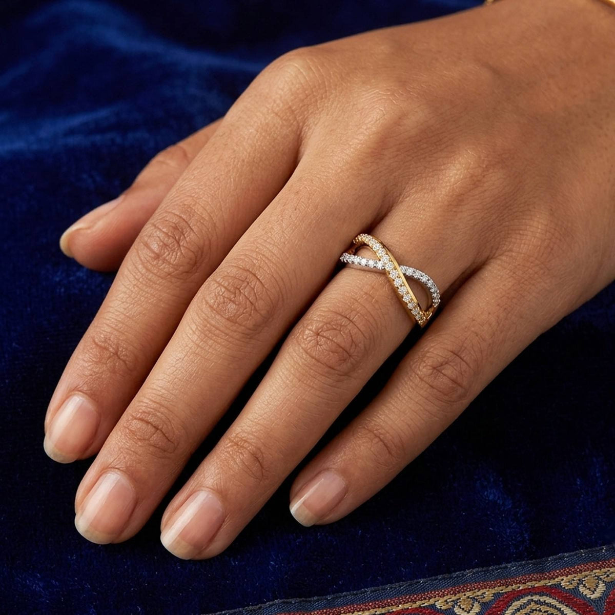 Close-up shot of a gold and diamond half- eternity ring.