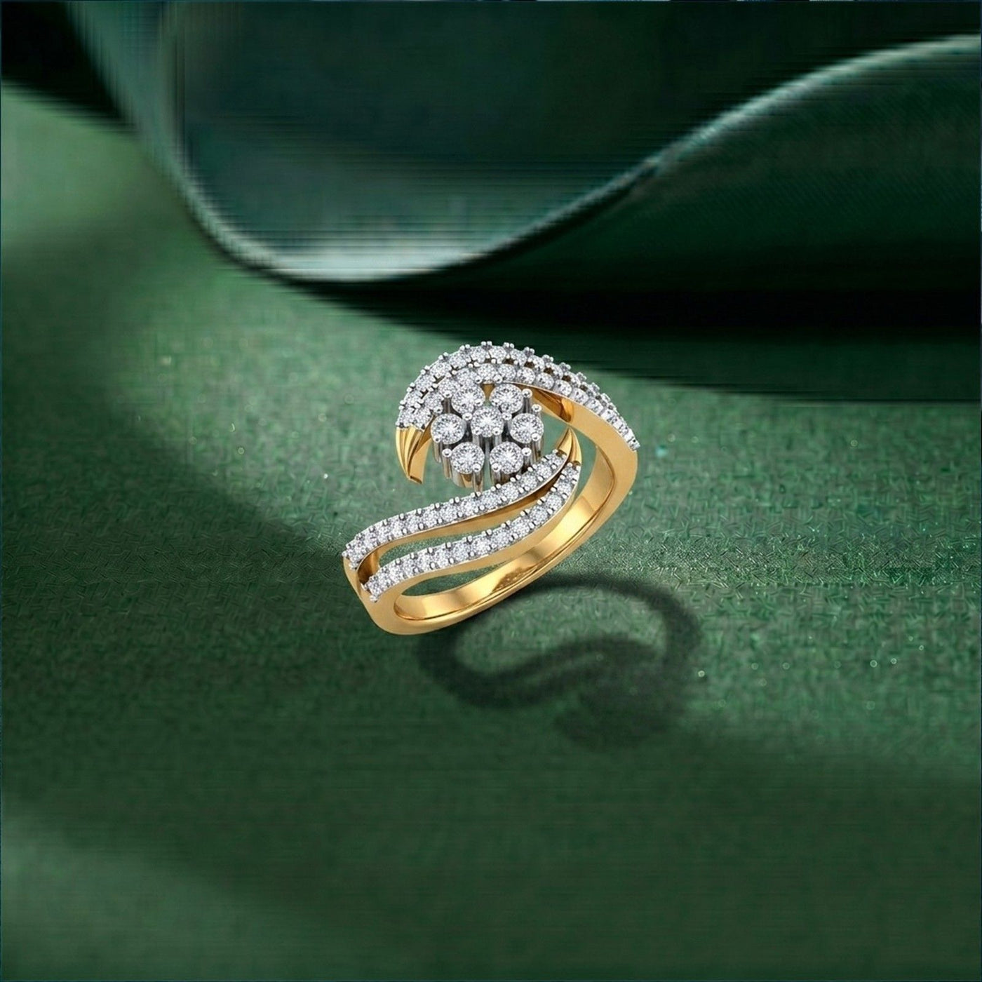 Gold ring with diamonds on a green surface.