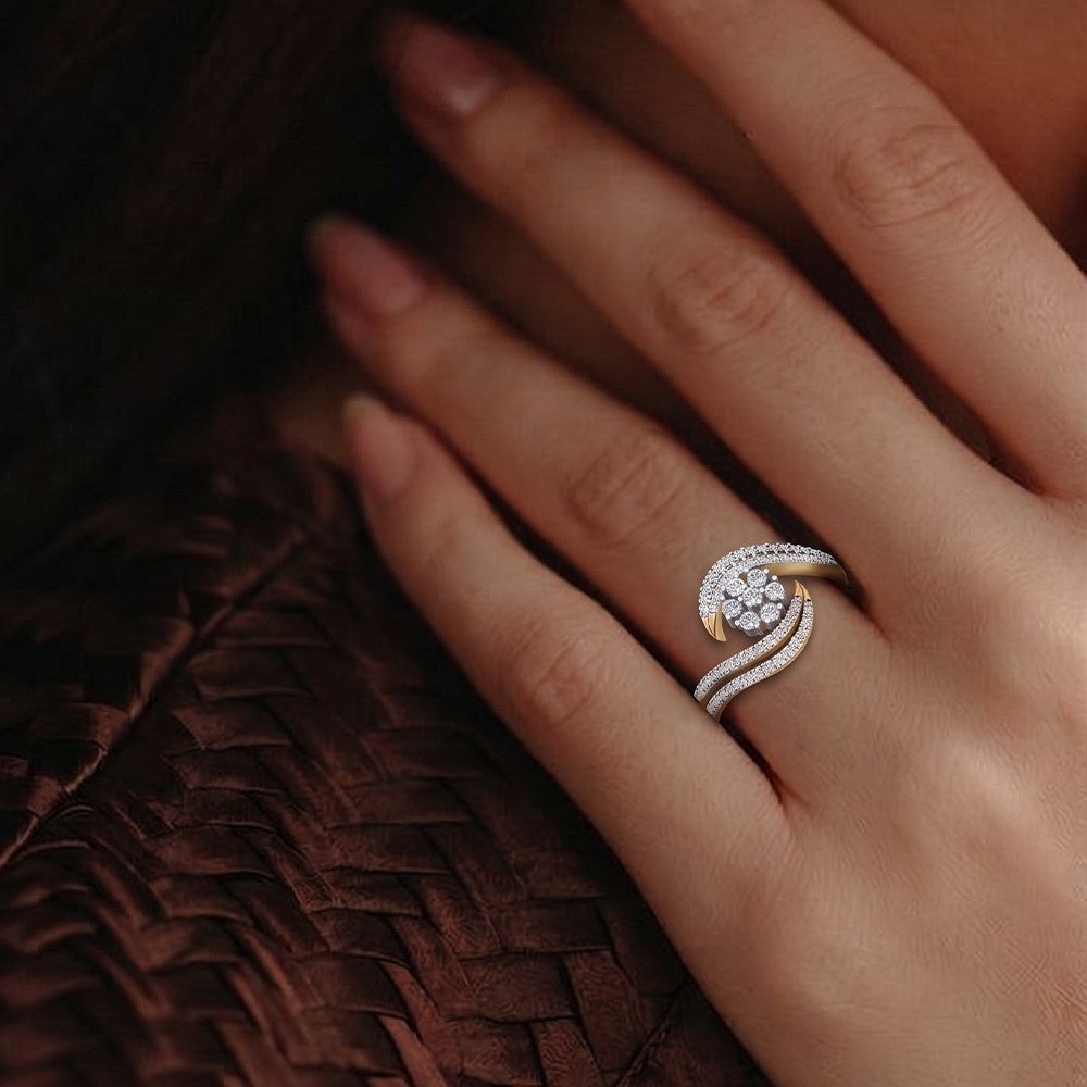 Close-up of a hand wearing a diamond ring on a textured brown surface.