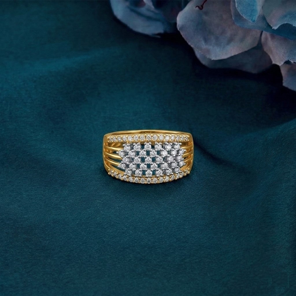 Gold and diamond ring on a textured teal surfac.