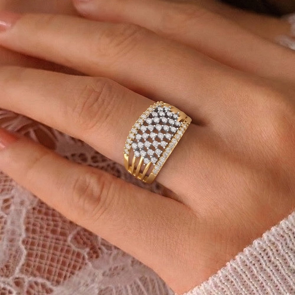 Gold ring with diamonds on a person's finger against a lace background.