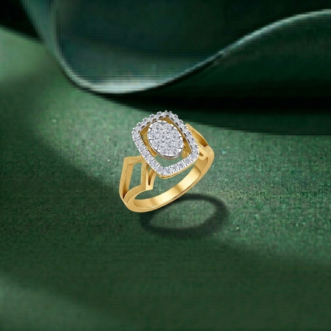 Gold ring with a diamond halo design on a green background.