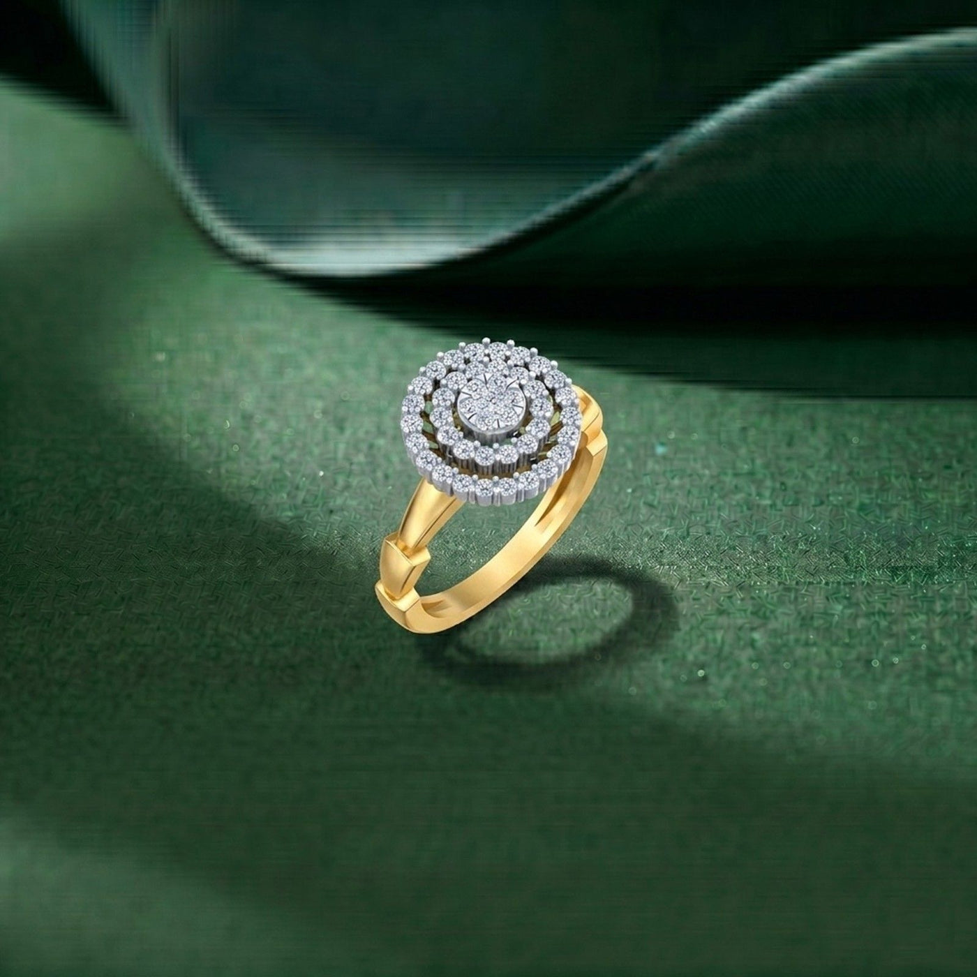 A gold ring with a circular cluster of clear stones, displayed on a dark green textured surface.