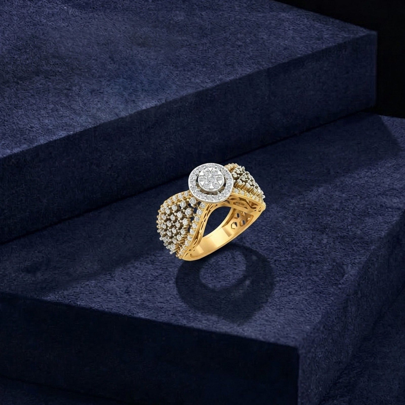 Gold ring with diamonds on a dark blue textured surface