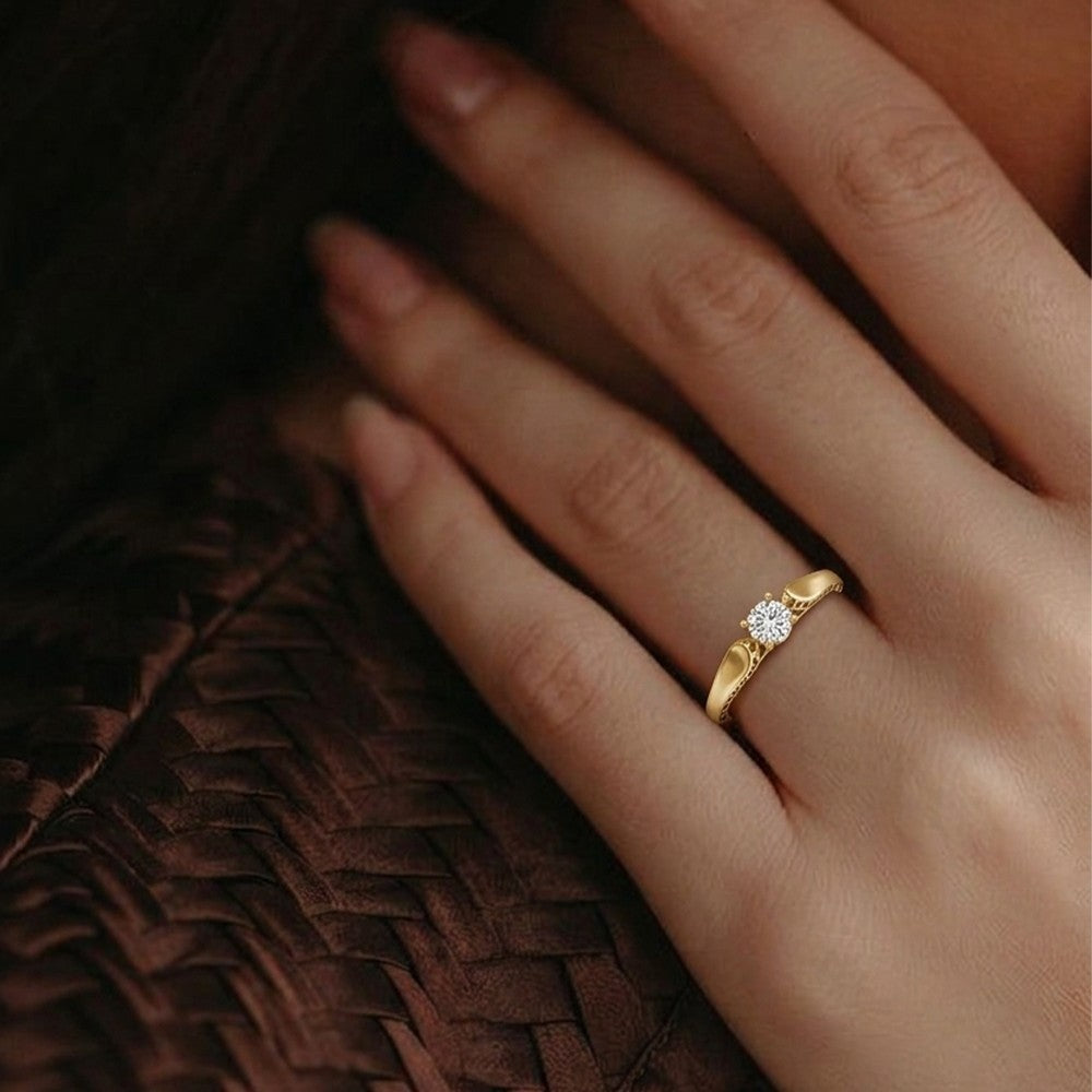 A close-up of a hand wearing a delicate ring, resting against a dark brown woven textured background.