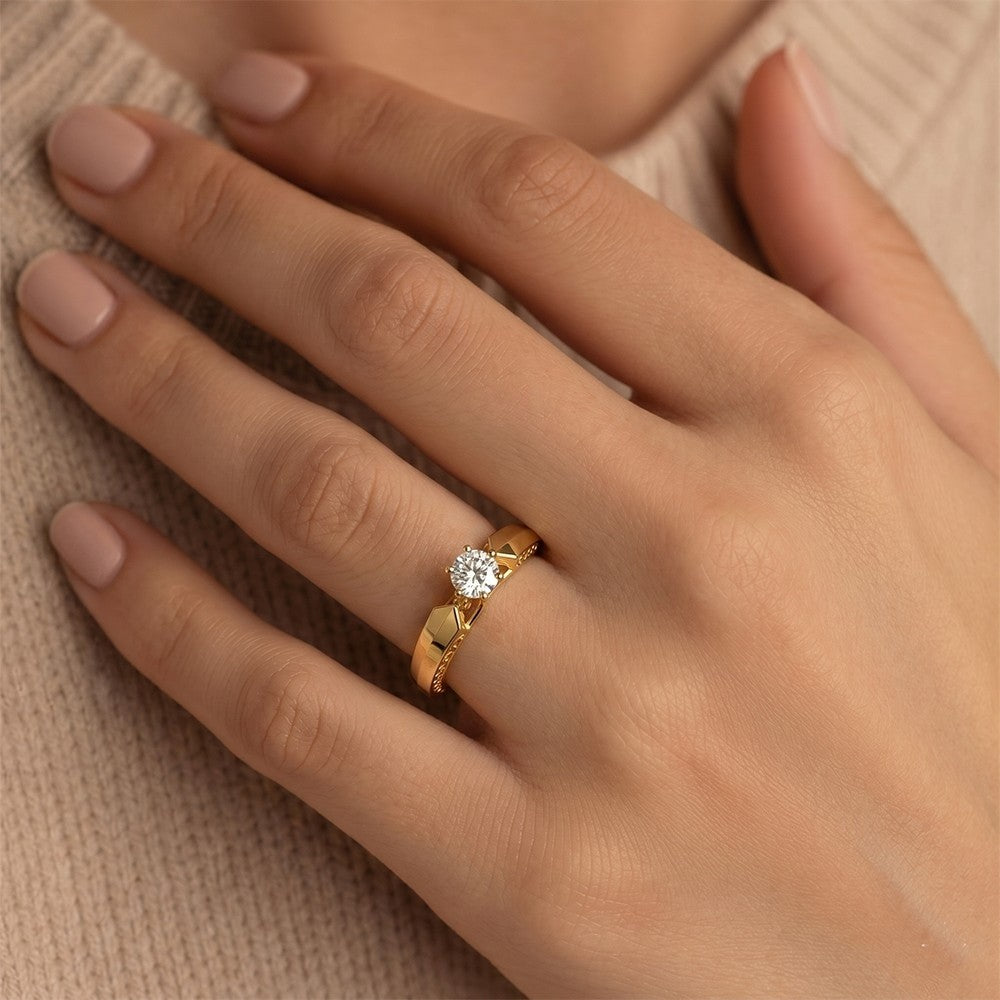 Close-up shot of a gold and diamond with solitaire ring.