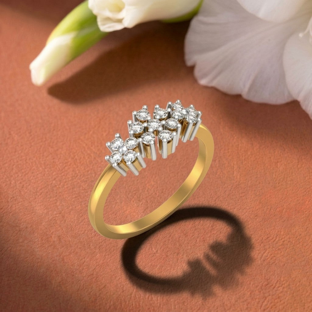A gold and diamond ring with a cluster, displayed on a textured brown surface.