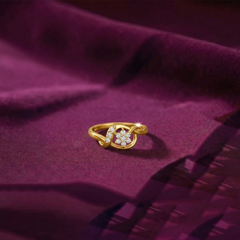 Gold and diamond with floral design on a magenta surfce. 