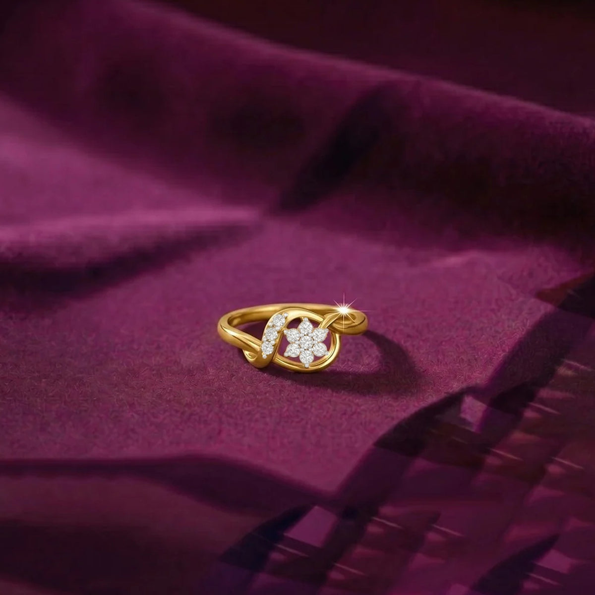 Gold and diamond with floral design on a fabric surface.