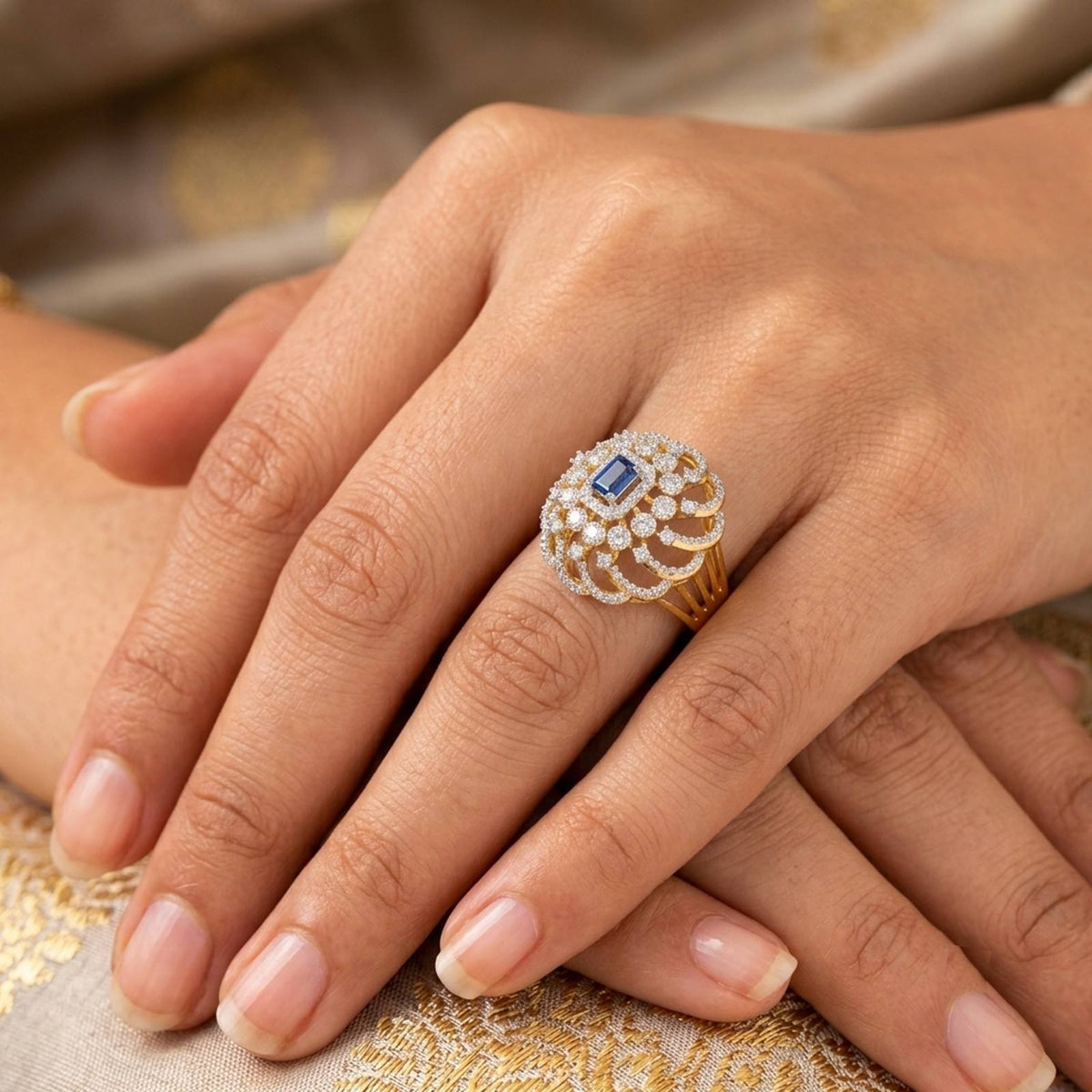 Close-up shot of a gold and diamond with sapphire rectangular gemstone setting ring.