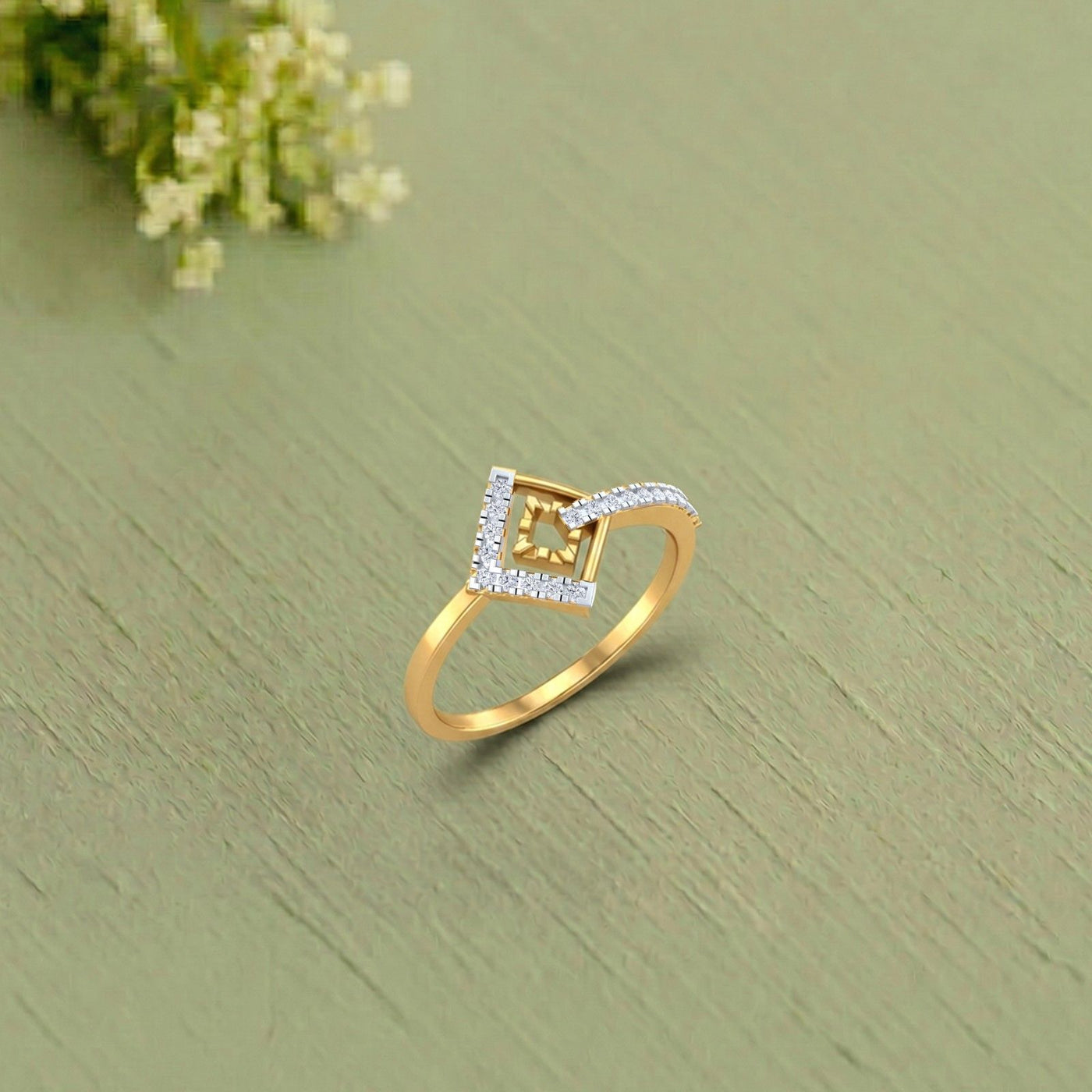 Gold and diamond women's ring on a saga texture surface.