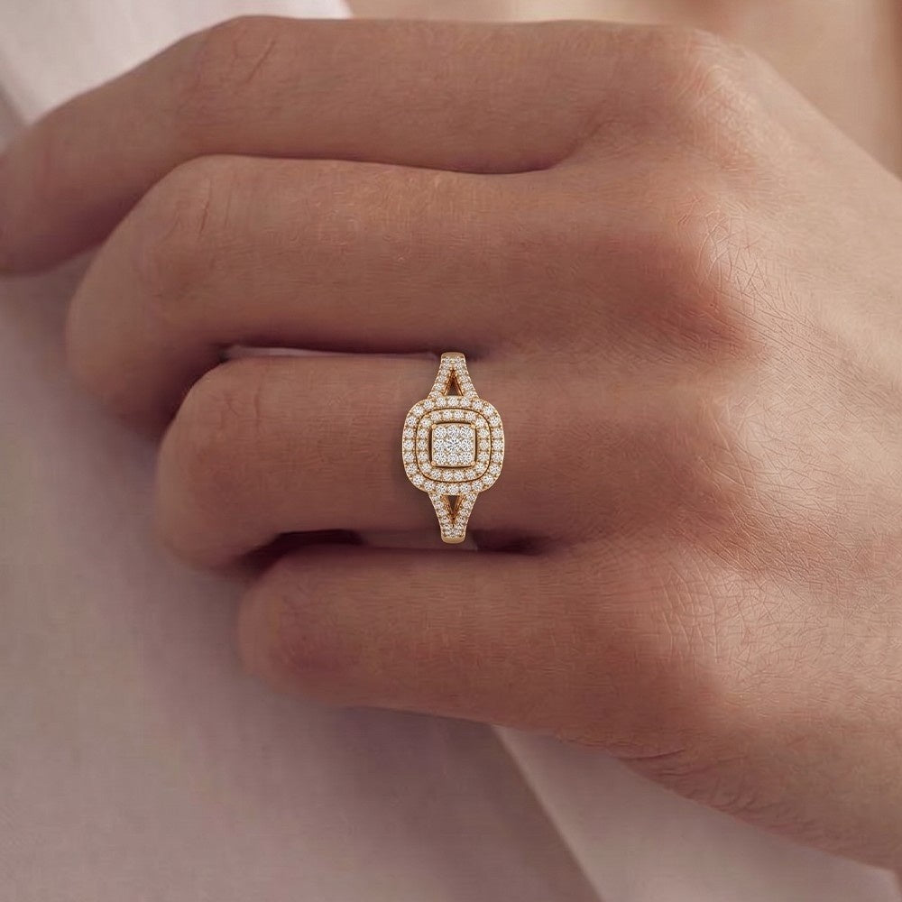 Rose gold ring with diamonds on a hand against a neutral background