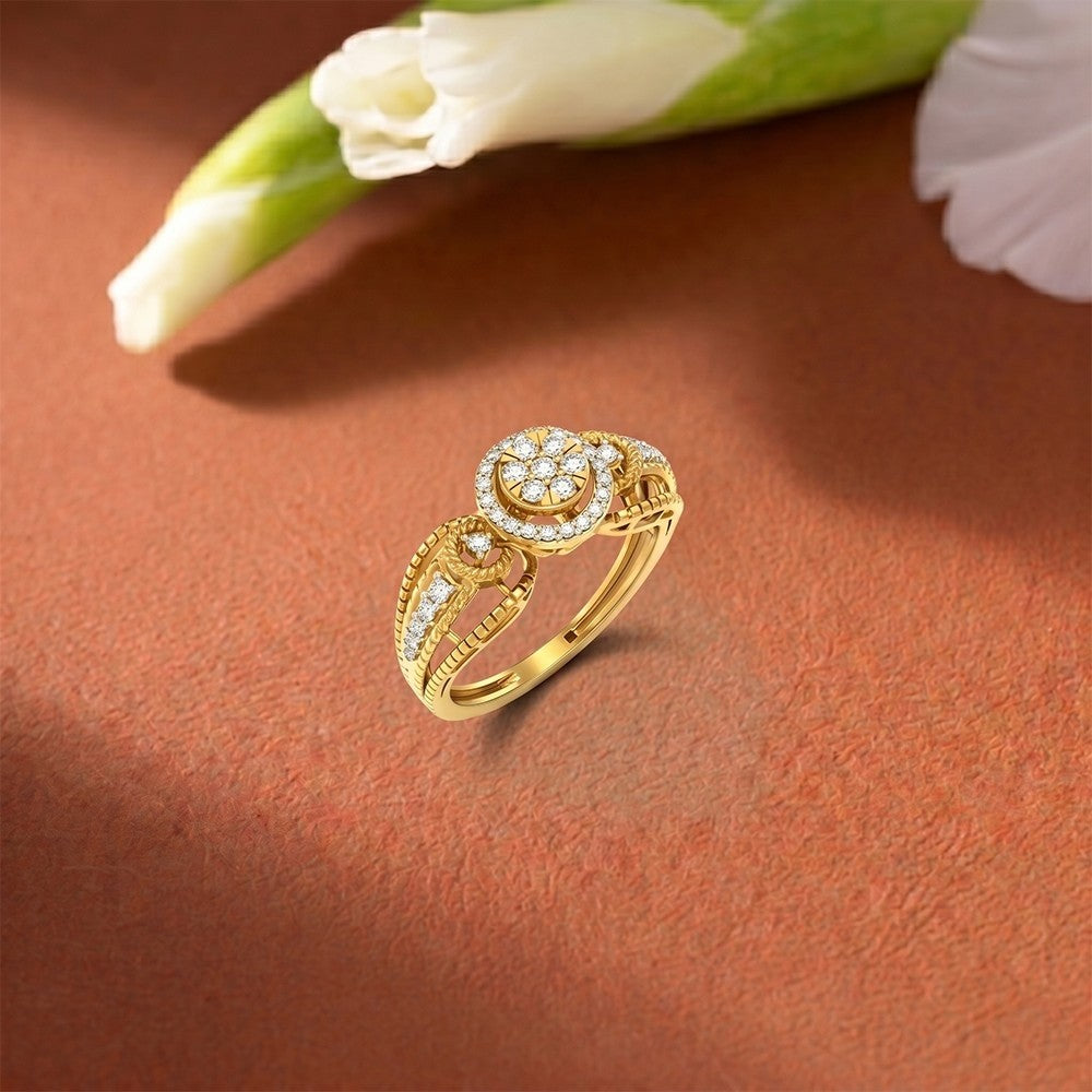 A gold and diamond ring with a cluster center, resting on a textured brown surface.