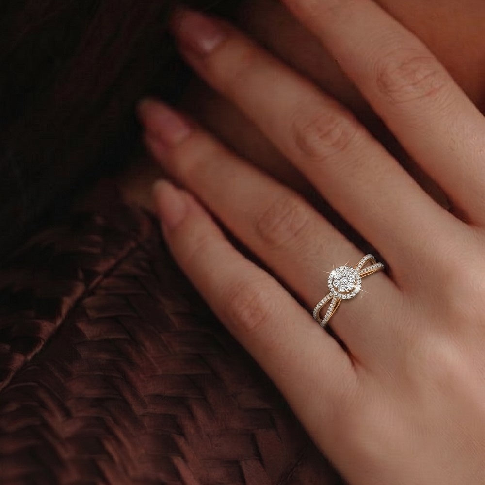 Gold ring with a diamond on a person's finger against a brown textured background
