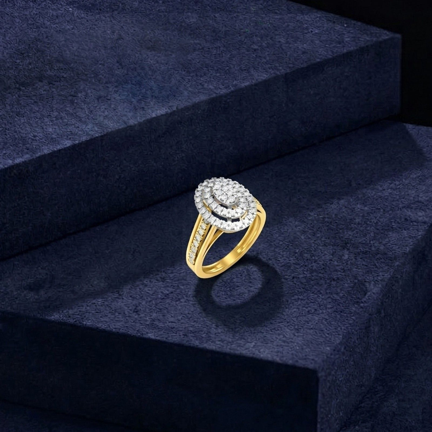 Gold and diamond ring on a dark blue textured surface.