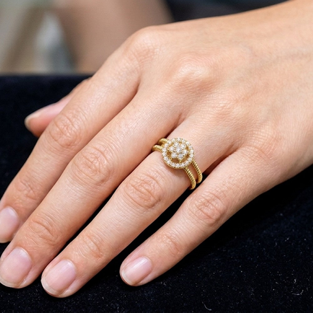 Close-up shot of a gold and diamond women's ring.
