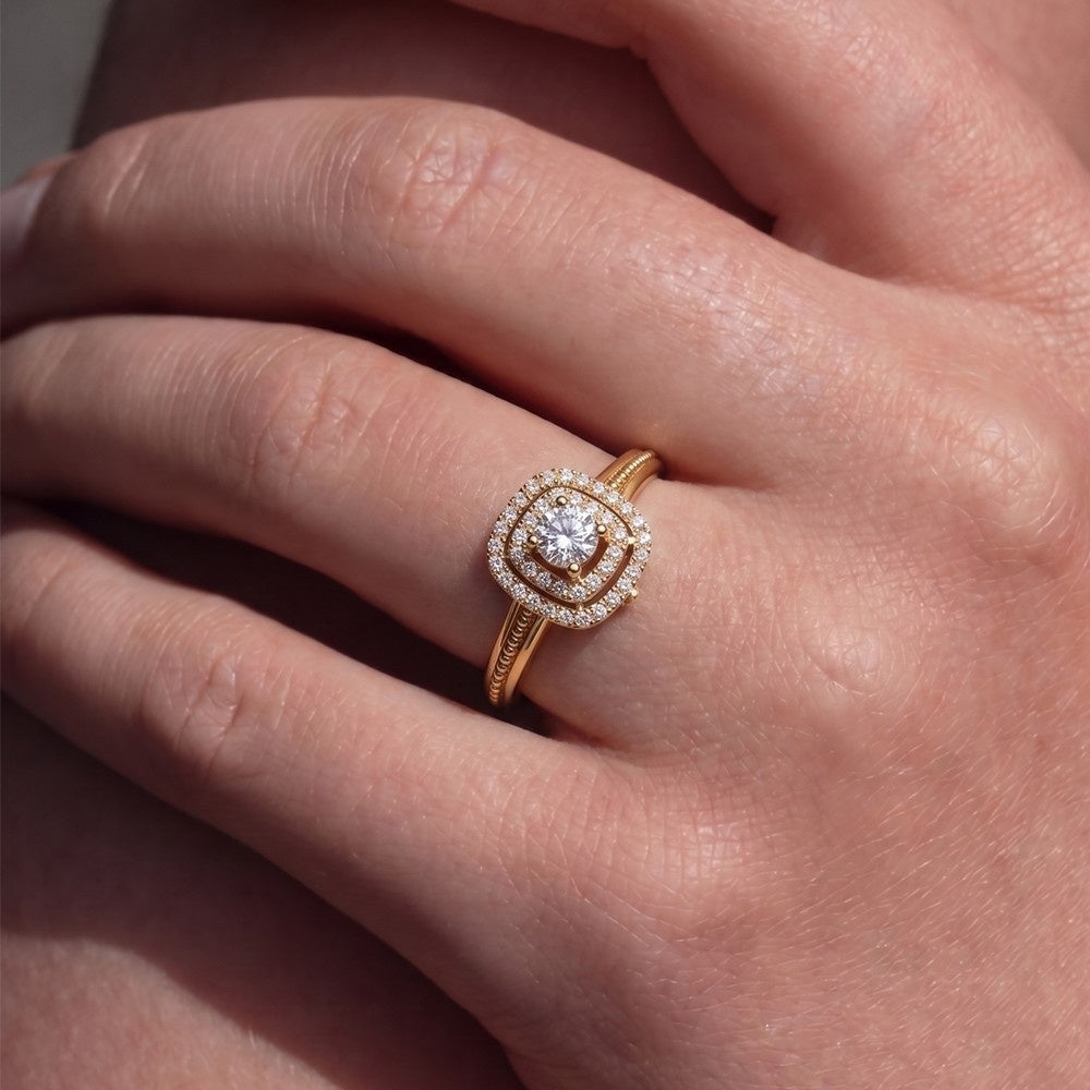 Rose gold ring with a diamond on a hand