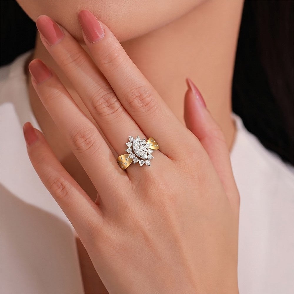 A close-up lifestyle shot of a woman's hand wearing a gold and diamond ring.