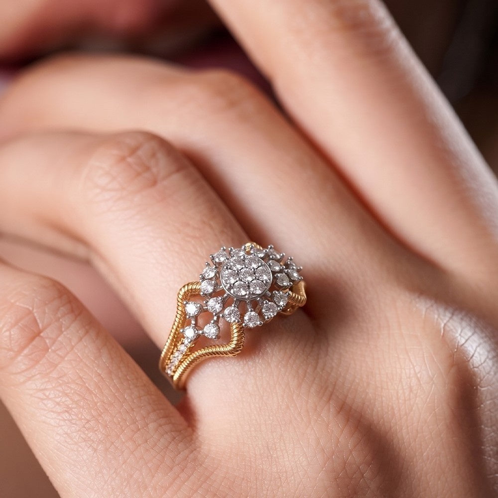 Gold ring with diamonds on a person's finger.