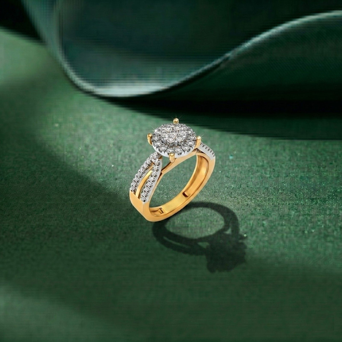Gold ring with diamonds on a green surface.