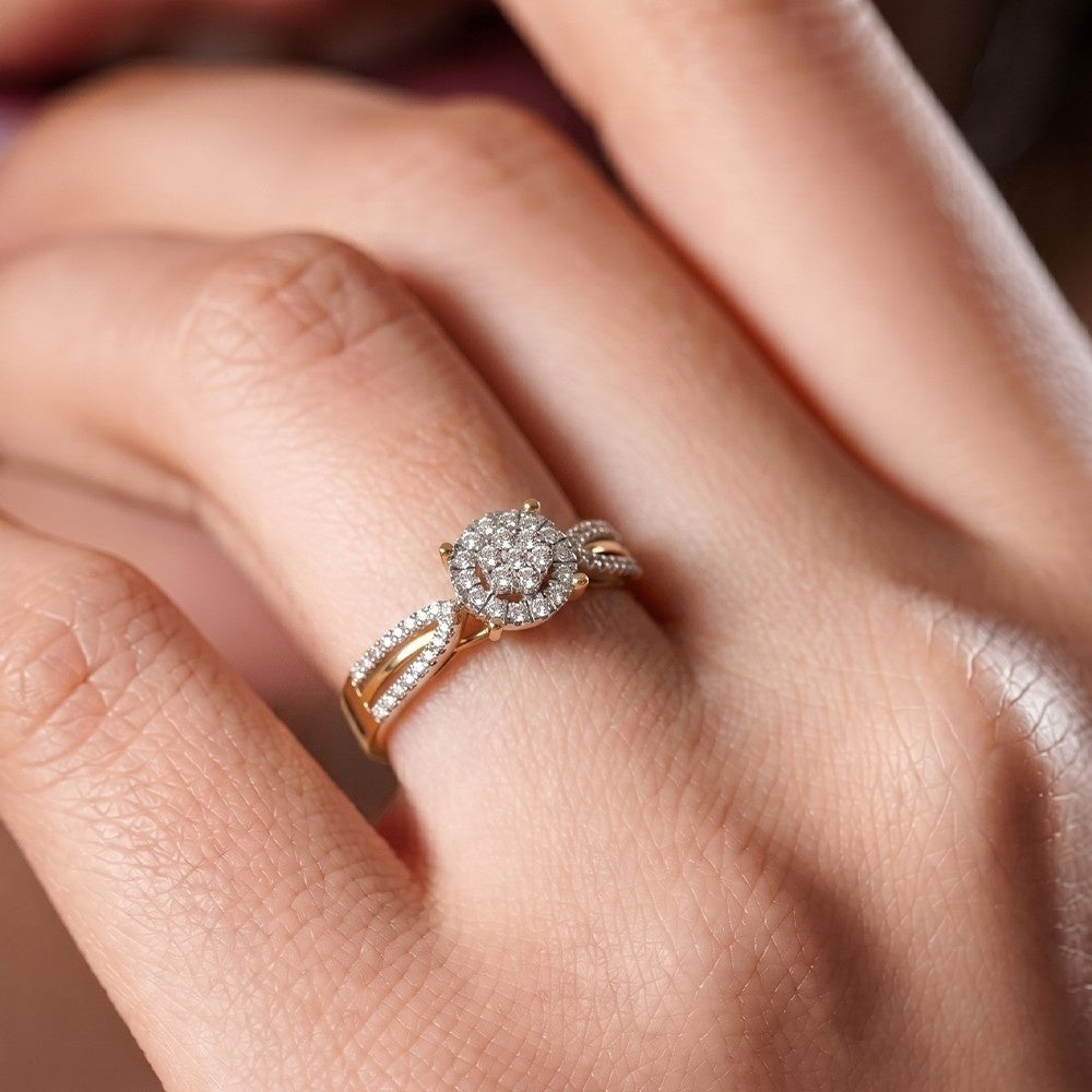 Gold and diamonds with cluster women's ring on a hand.