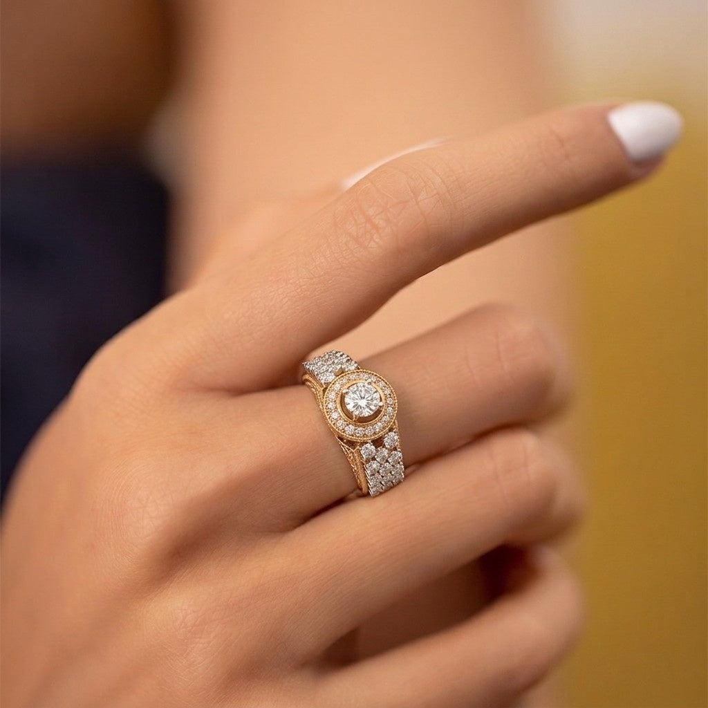 A close-up of a hand wearing a gold and diamond ring with a round-cut center.