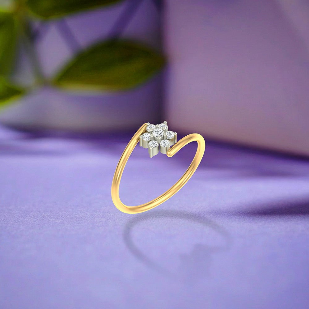 Gold and diamond with floral cluster on a purple surface.