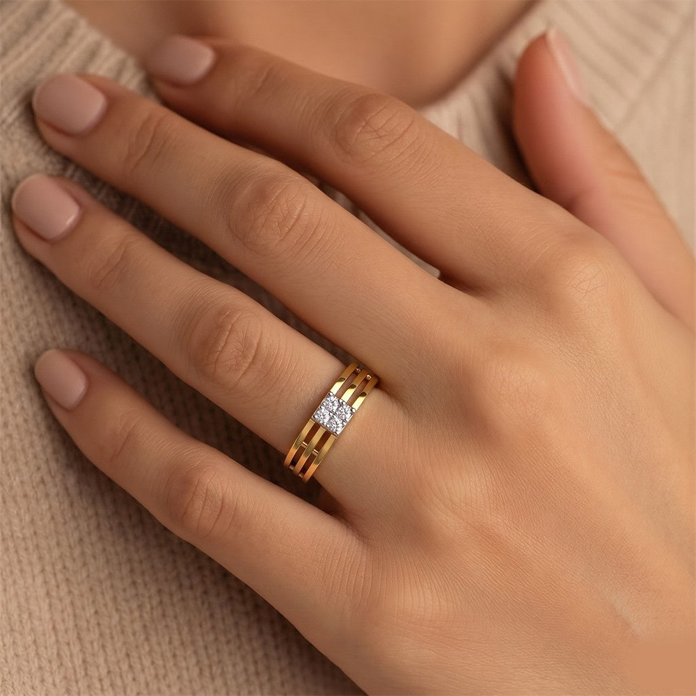 Gold ring with a diamond on a hand against a beige background