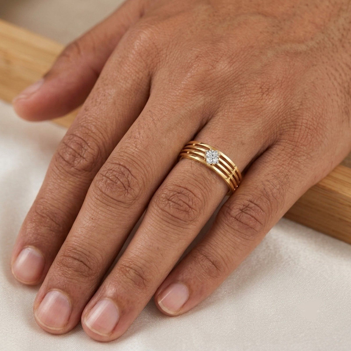 Close-up shot of a gold and diamond men's ring.