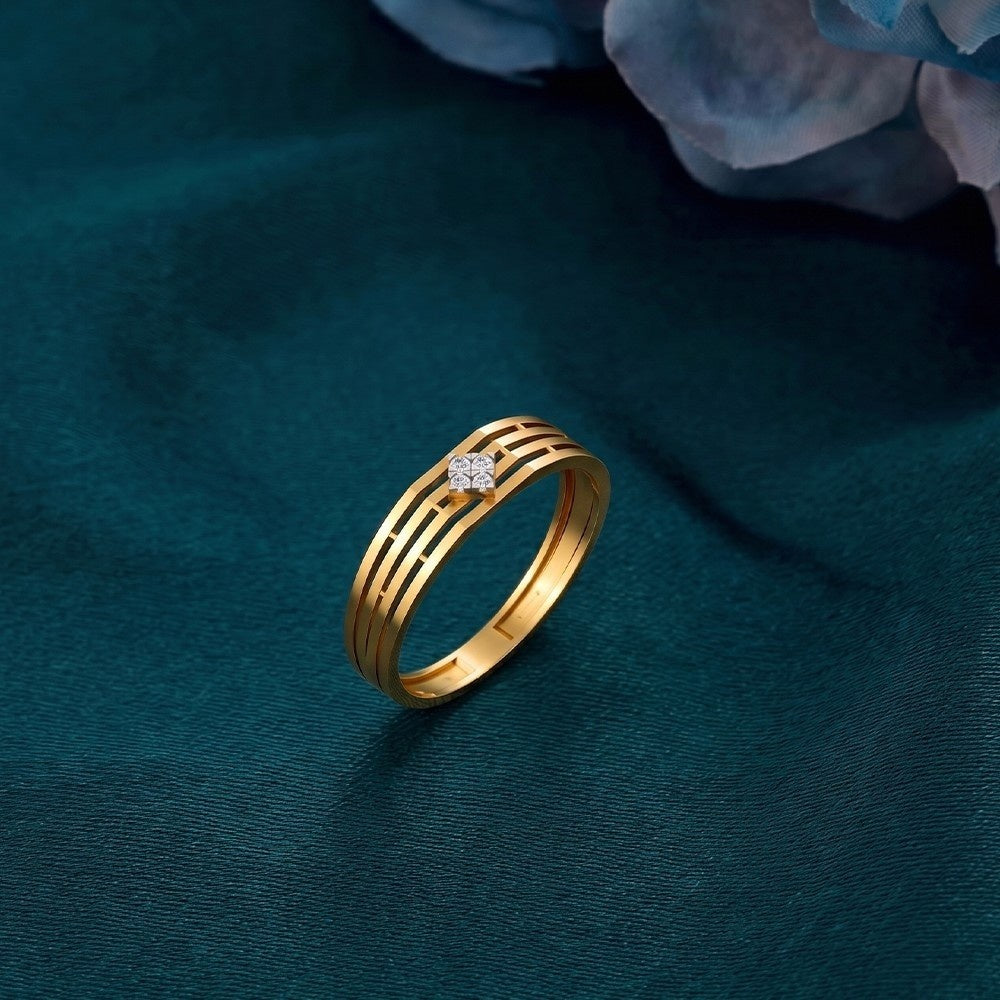 Gold ring with a diamond on a blue background