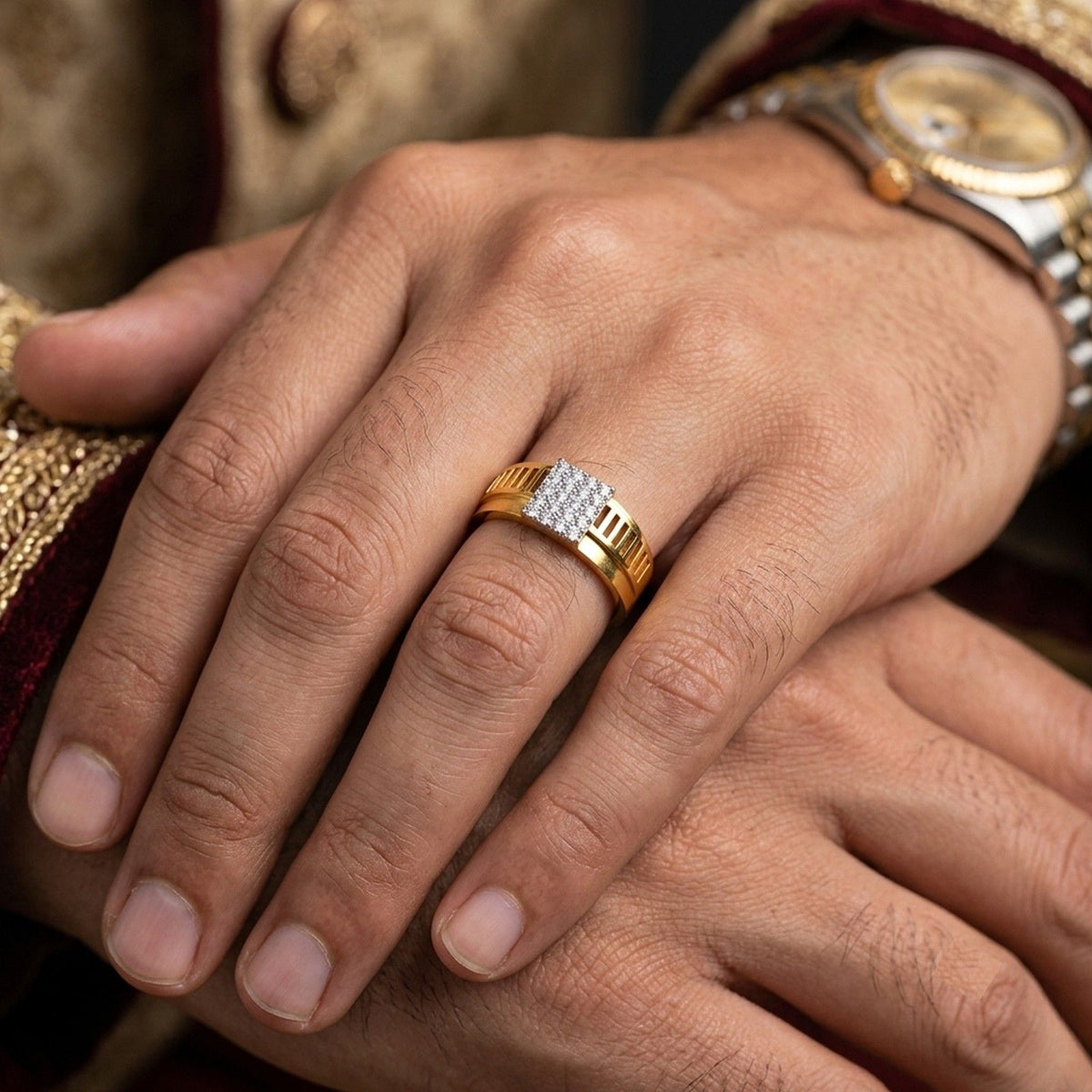 Gold ring with diamonds on a person's finger.
