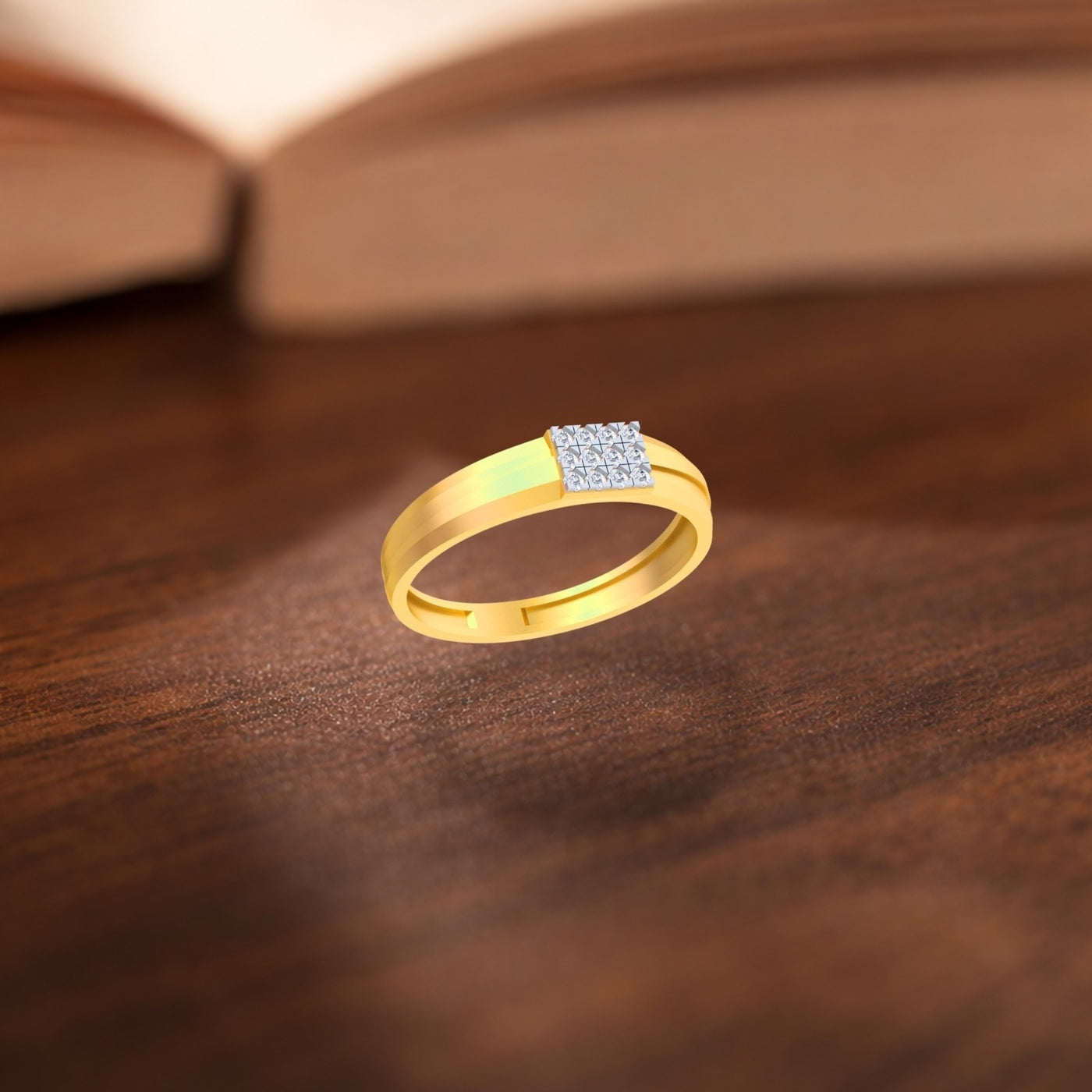 Gold ring with a diamond on a wooden surface.