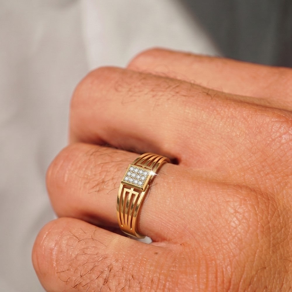 Close-up shot of a gold and diamond men rings.
