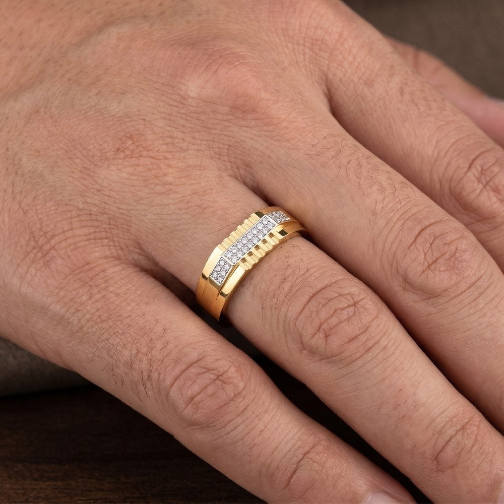 Hand wearing a gold and diamod men ring.