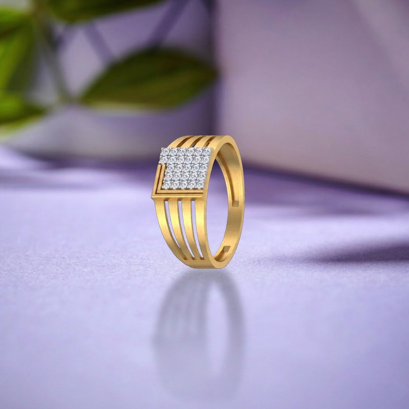 Gold ring with diamond accents on a purple surface.