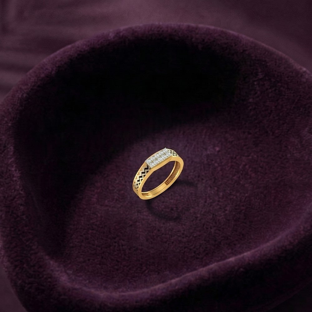 Gold and diamond band with rectangle cluster on a purple fabric surface.