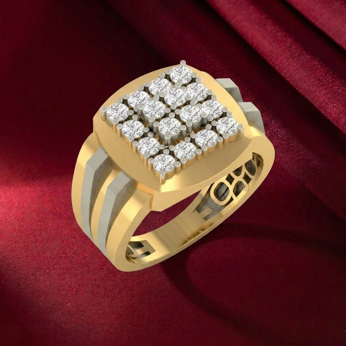 A gold signet ring with a square face set, shown on a red surface.